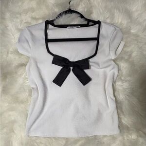 White Top with Black Bow Accent